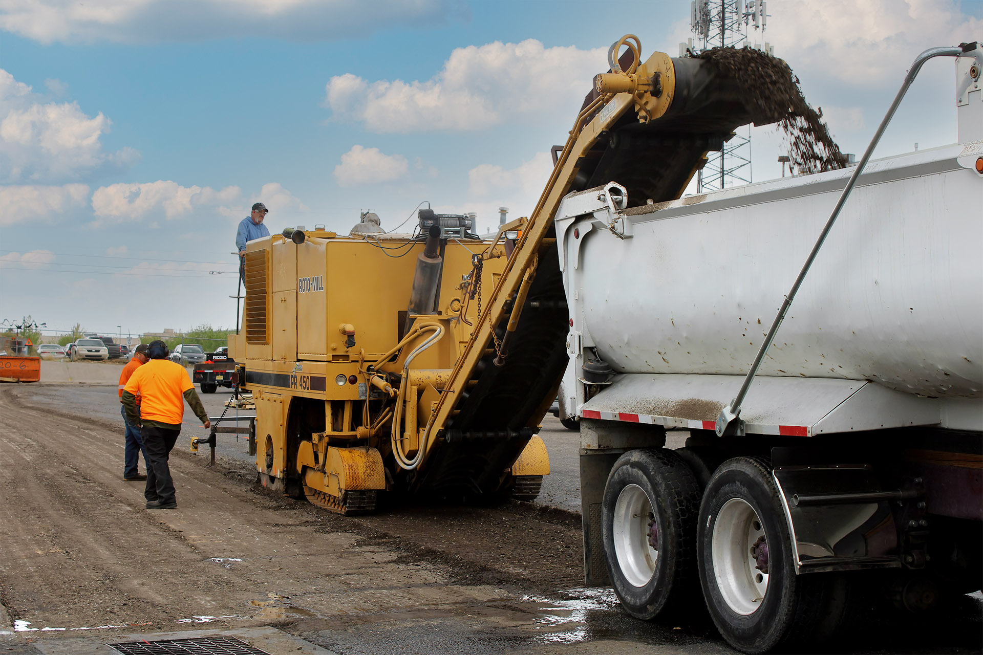 The Pioneer Paving crew milling an asphalt surface to prepare it for repairs