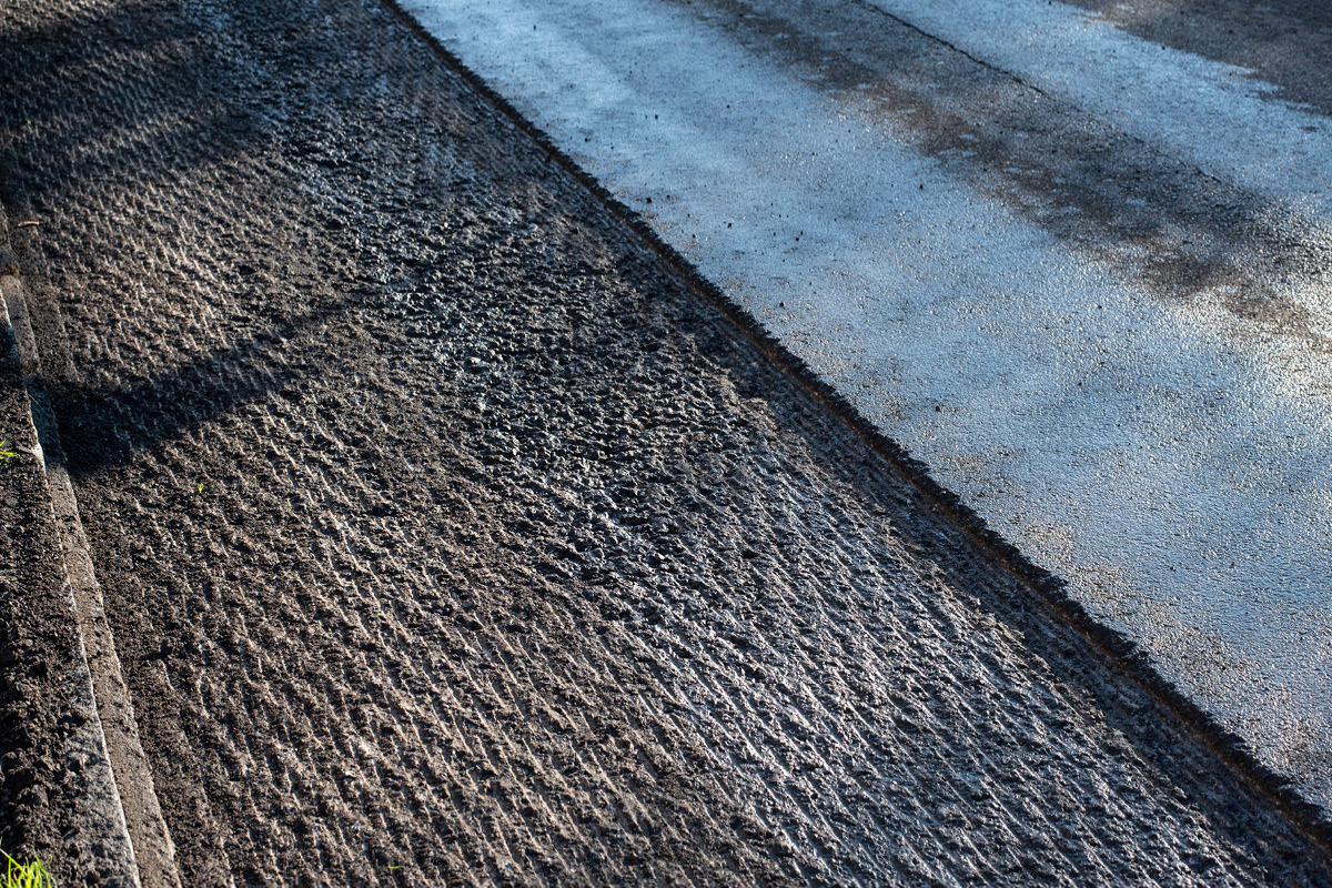 the milled surface of a damaged asphalt road prepared for reconstruction