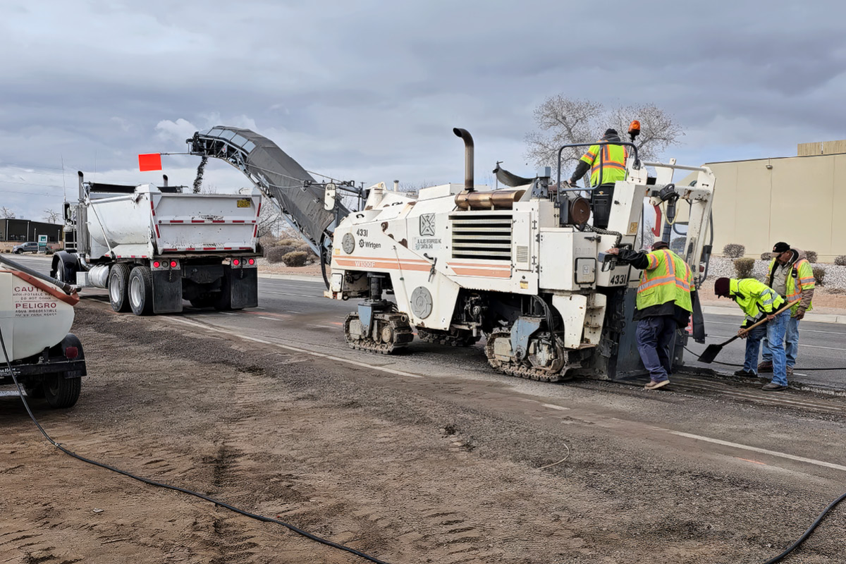 The Pioneer Paving and Grading crew milling a damaged road surface on the west-side of Albuquerque so it can be resurfaced